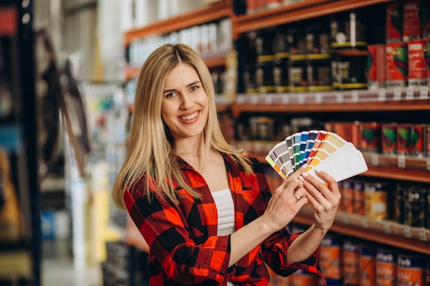 Customer choosing paint colours at a hardware store
